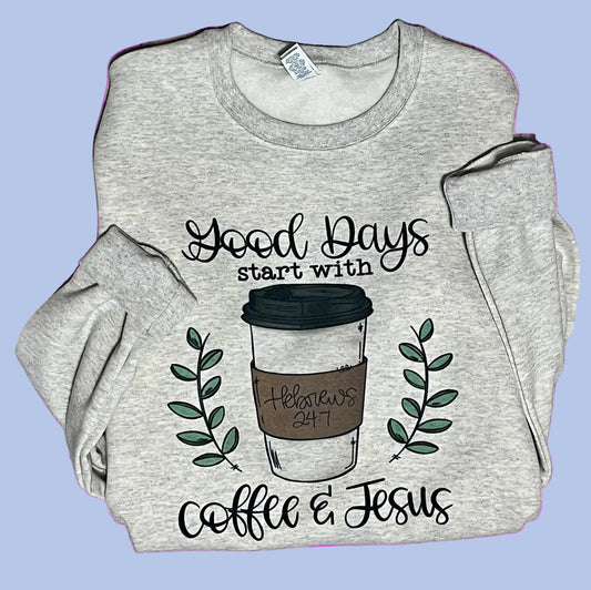 A gray crewneck sweatshirt with text 'Good days start with Jesus and coffee' and an illustration of a coffee cup and greenery on the front.