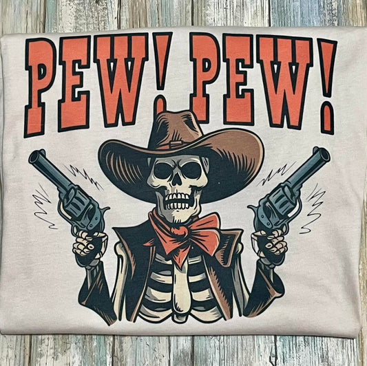 This image features a striking skeleton cowboy tee, showcasing a bold and playful design. The t-shirt is short-sleeved and comes in a natural color, ideal for casual wear.